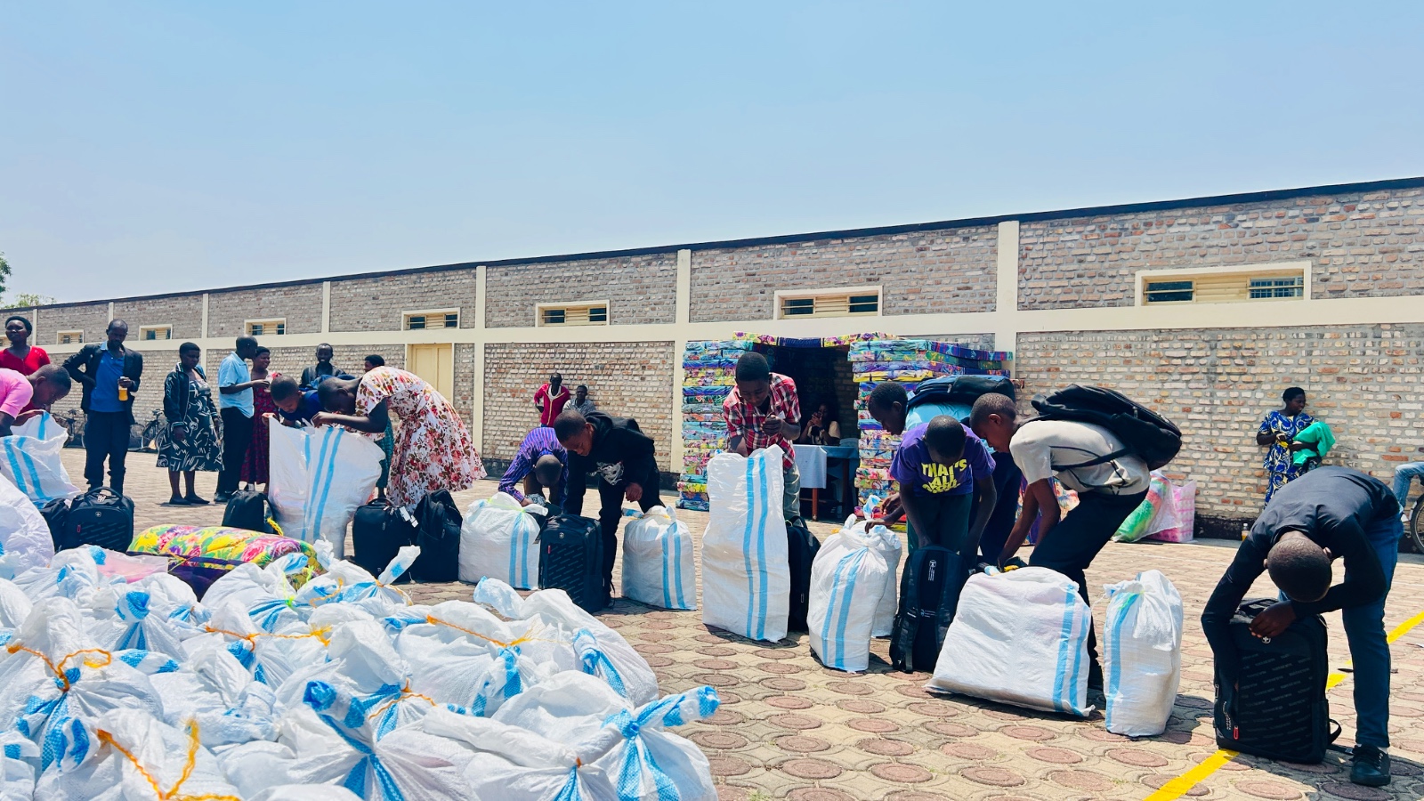 Nyanza district; Students receiving school supplies